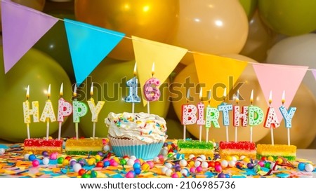 Cream cupcake with a candle for sixteen years, Greeting colorful card happy birthday to a child of 16, birthday cupcake with candles and birthday decorations