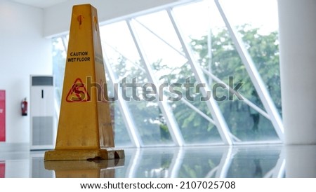 Wet floor sign cone in the lobby mall