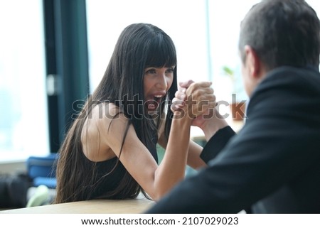 Young woman signing contracts and handshake with a manager,Businesswoman and businessman HR manager interviewing woman.