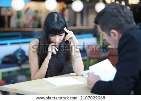 Businesswoman and businessman HR manager interviewing woman. Candidate female sitting interviewers on background. Human resources,Young attractive woman during job interview