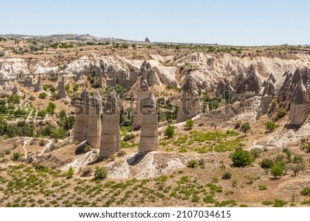 A Beautiful view of the valley of love in Cappadocia with mountain peaks in the summer day