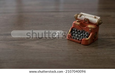 Miniature typewriter with a search bar.