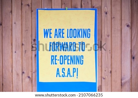 Opening soon sign but currently closed due to covid-19