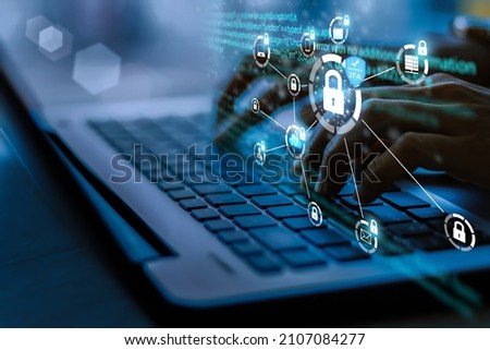 Business concept, technology, internet and network. young businesswoman using laptop in office Select the 2FA security icon on the virtual display. blue tone concept Royalty-Free Stock Photo #2107084277