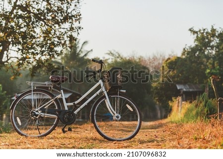 Landscape of vintage bicycle at sunrise. For making gift pictures, postcards. morning exercise by bike.