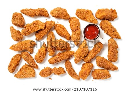 Delicious crispy fried breaded chicken breast strips with ketchup. Isolated on white background. top view Royalty-Free Stock Photo #2107107116