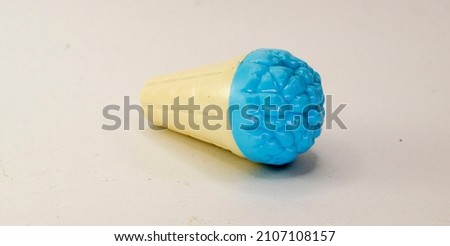 used children's toys, in the form of blue ice cream. isolated on white.