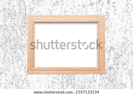 Empty copy space photo frame. Wooden blank picture frame isolated. Home wall decoration. Rectangle space for graphic design. White marble wall.