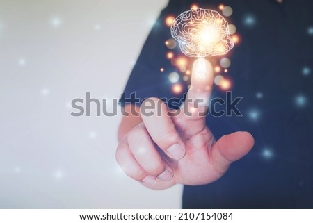human hand holding brain, Brain inside the hands of the businessman background,The concept of the business idea. Royalty-Free Stock Photo #2107154084