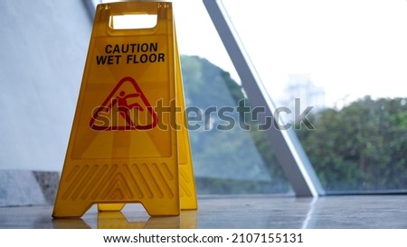 Yellow caution wet floor sign