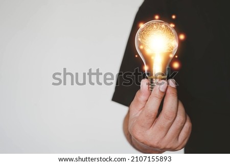 Brain inside the hands of the businessman background. Brain Nervous System concept, Creative The brain in the light bulb, The concept of the business idea. Royalty-Free Stock Photo #2107155893