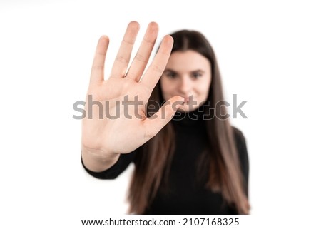  Stop! Young beautiful girl over isolated white background making stop gesture with her hand