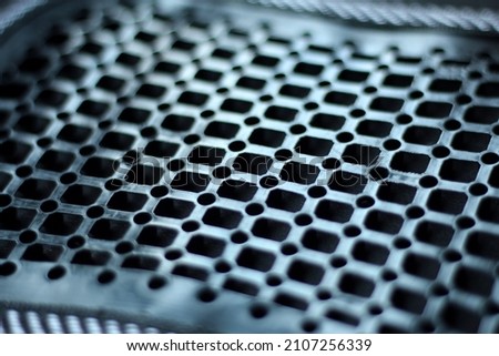 It technology texture background: black metal iron grating, grid or steel grate. Venting, ventilation with geometric design pattern, high tech, computer internet web