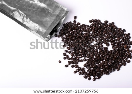 bag with coffee beans on white background