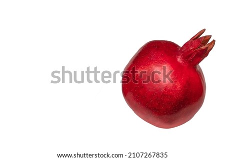 Whole pomegranate on white background. Space for text. Fresh raw fruit isolated on white background. Healthy life concepts.