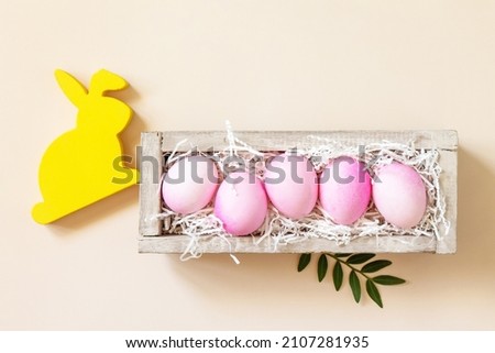 The minimum concept of Easter. Easter Eggs painted pink eggs on trendy pastel background. Top view flat lay. Copy space.