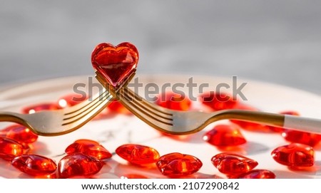 Banner. Heart on a fork close-up. Festive table setting. The concept of a holiday for cafes and restaurants. valentine's day. A copy of the space for the text. Royalty-Free Stock Photo #2107290842
