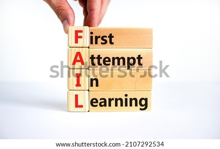 FAIL first attempt in learning symbol. Wooden blocks with words FAIL first attempt in learning. Beautiful white table, white background, copy space. Business, FAIL first attempt in learning concept. Royalty-Free Stock Photo #2107292534