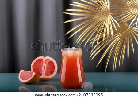 Grapefruit juice. Refreshing freshly squeezed drink with ice.	