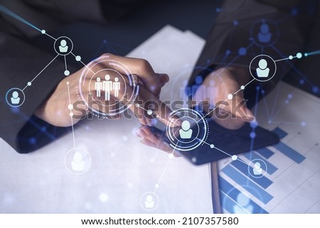 Businesswoman in formal wear checking the phone to sign the employment agreement to boost her career and gain new opportunities in personal growth. Concept of success. Social media hologram icons
