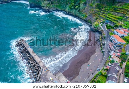 Aerial drone view of black sand beach in Seixal, Madeira island