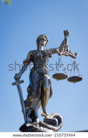 picture of sculpture of themis, femida or justice goddess on bright blue sky outdoors copy space background