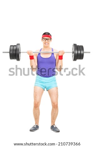 Full length portrait of a determined guy lifting a heavy barbell isolated on white background