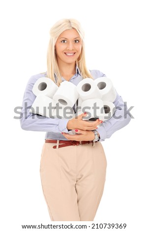 Woman holding a pile of toilet paper rolls isolated on white background
