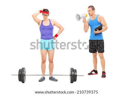 Coach motivating a nerdy guy to exercise, with a megaphone isolated on white background