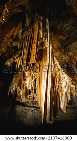 Dripstone in the Luray Cavern in Virginia USA. The picture shows stalactites hanging from the Cave. 