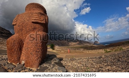 Tiki ancestral sculture in volcanic stone on the island of Ua Huka in French Polynesia Royalty-Free Stock Photo #2107431695