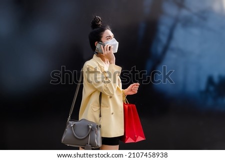 Asian women Thai people shopping in malls on vacation live a new normal in the capital travel in the capital Epidemic Prevention in Bangkok, Thailand Royalty-Free Stock Photo #2107458938