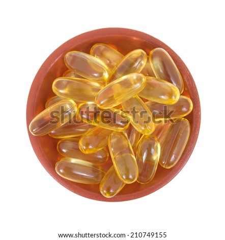 Top view of a dish filled with cod liver oil gel capsules.