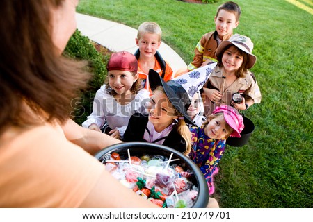 Halloween: Group Of Kids Want Halloween Candy Royalty-Free Stock Photo #210749701