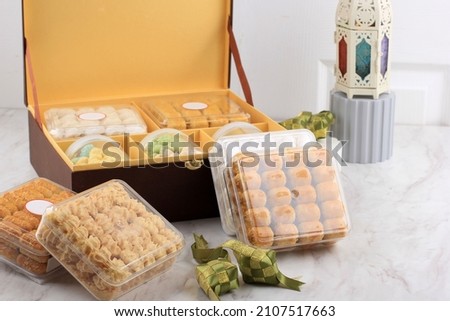 Selective focus  Parcel Hampers Gift on Assorted Indonesian Cookies for Eid al Fitr.  Royalty-Free Stock Photo #2107517663