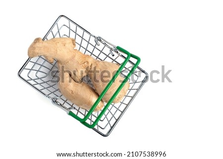 Ginger root in a shopping basket on a white background