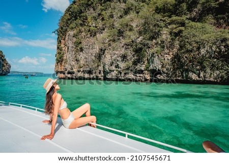 Traveler woman in swimsuit relaxing on boat looking beautiful natural Pileh lagoon Krabi, Water travel Phuket Thailand beach, Tourist girl on summer holiday vacation, Tourism destination Asia trip Royalty-Free Stock Photo #2107545671