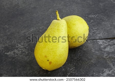 Sweet tasty ripe Yellow pear over background