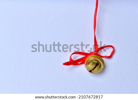 red ribbon bell white wall texture background