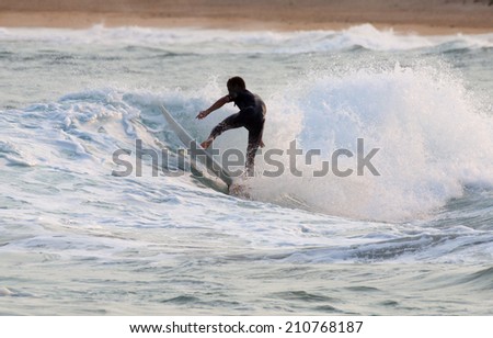 Surfer showing the amazing skills required 