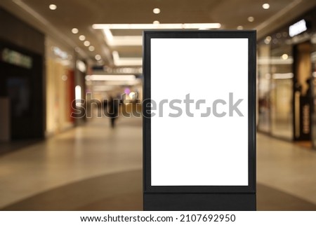 Blank advertising board in shopping mall. Space for text