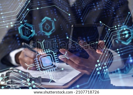 African American businesswoman is signing the contract to create a start up for the conference and gain investments for innovative service. Checking the details at smartphone. Hologram tech graphs.