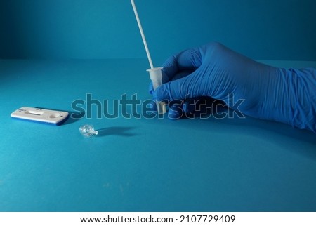 Antigen Test And Female Hand Of Medicine Worker, Covid-19, Safety Measures In The Country, Germany. Royalty-Free Stock Photo #2107729409