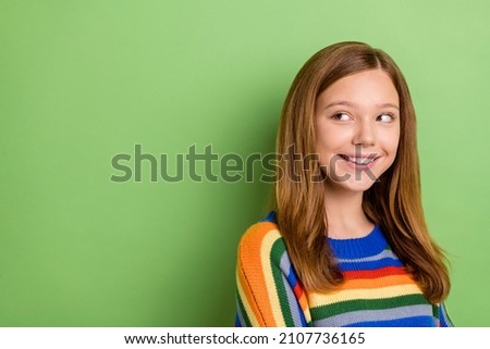 Portrait of attractive girly cheerful cunning pensive girl looking aside copy space isolated over bright green color background