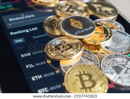 Cryptocurrency on Binance trading app, Bitcoin BTC with BNB, Ethereum, Dogecoin, Cardano, Litcoin, altcoin digital coin crypto currency defi p2p decentralized finance and fintech banking market Royalty-Free Stock Photo #2107741823