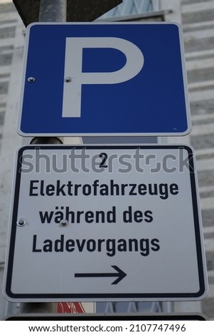 Sign of two parking places exclusively for the charging of electric cars, green mobility (vertical image), Kaiserslautern, Rhineland Palatinate, Germany