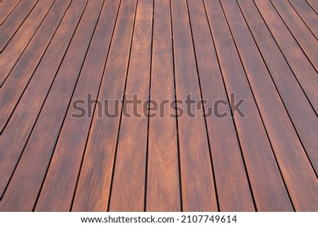Cumaru wood decking texture and grains background, cumaru deck exotic hardwood close up Royalty-Free Stock Photo #2107749614