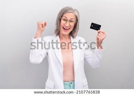 Photo of cool white hairdo aged leader lady hold card wear spectacles jacket isolated on grey color background