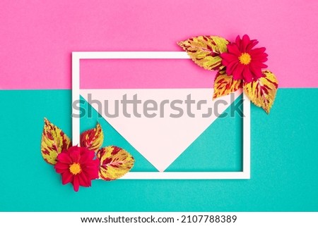 Happy Mother's Day, Women's Day, Valentine's Day or Birthday Pastel Colored Background. Multicolored flat lay greeting card template with beautiful flowers and empty picture frame.