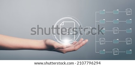 Document Management System (DMS) concept. Hand hold file icon Virtual screen automation software to archiving and efficiently manage and information with ERP. Corporate business technology. Royalty-Free Stock Photo #2107796294
